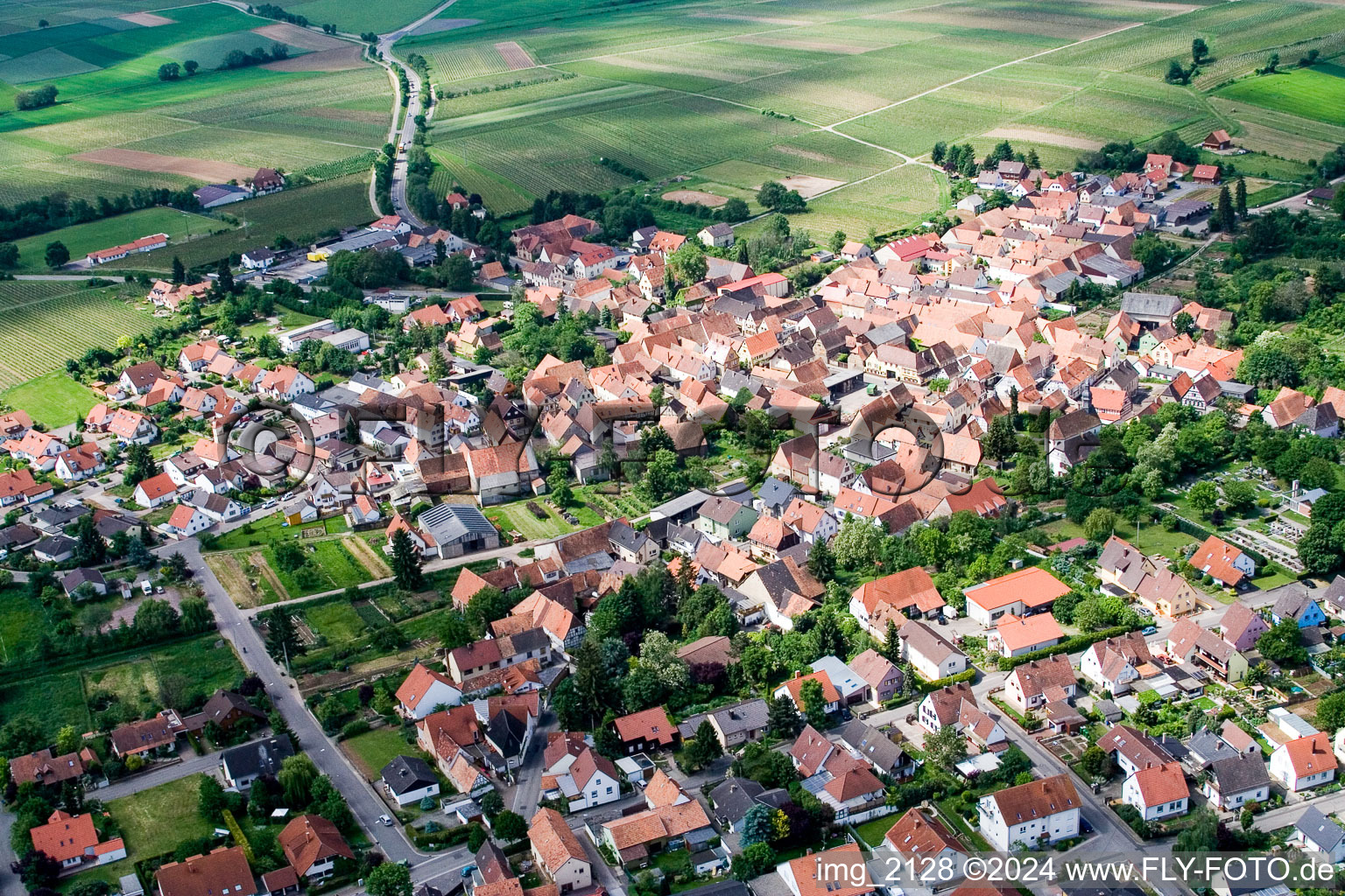 Village - view on the edge of agricultural fields and farmland in Impflingen in the state Rhineland-Palatinate from above