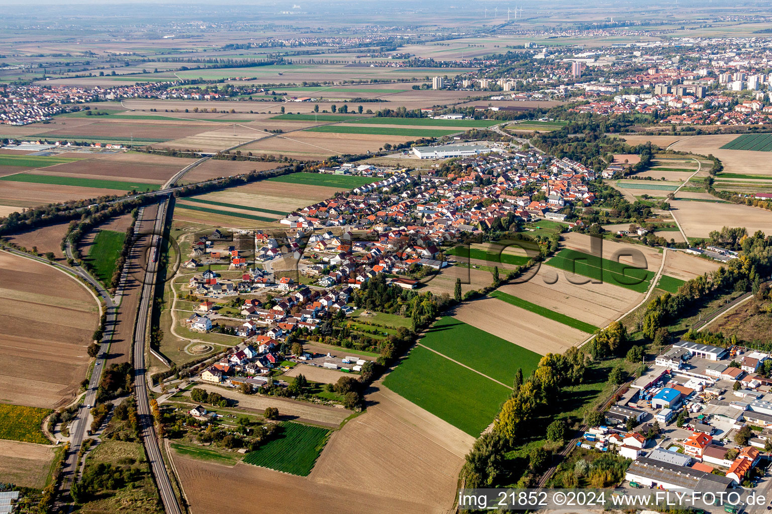 Aerial view of Village - view on the edge of agricultural fields and farmland in Studernheim in the state Rhineland-Palatinate, Germany