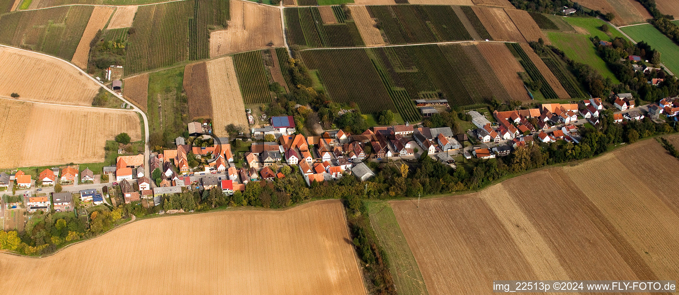 Aerial photograpy of Village - view on the edge of agricultural fields and farmland in Vollmersweiler in the state Rhineland-Palatinate