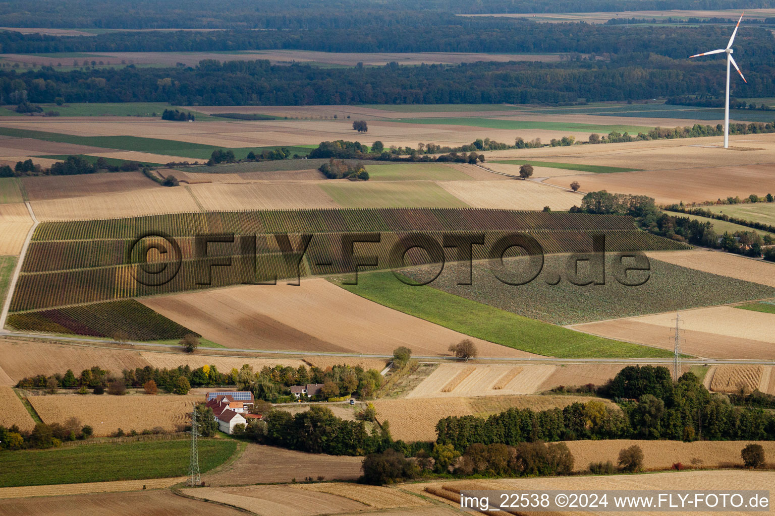 Windmill near watermill Altmuehle on a farm homestead on the edge of cultivated fields in Minfeld in the state Rhineland-Palatinate