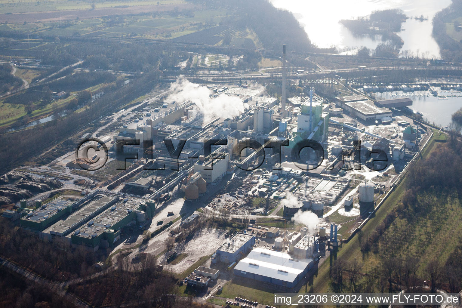 Oblique view of Building and production halls on the premises of Papierfabrik Stora Enso in the district Maxau in Karlsruhe in the state Baden-Wurttemberg