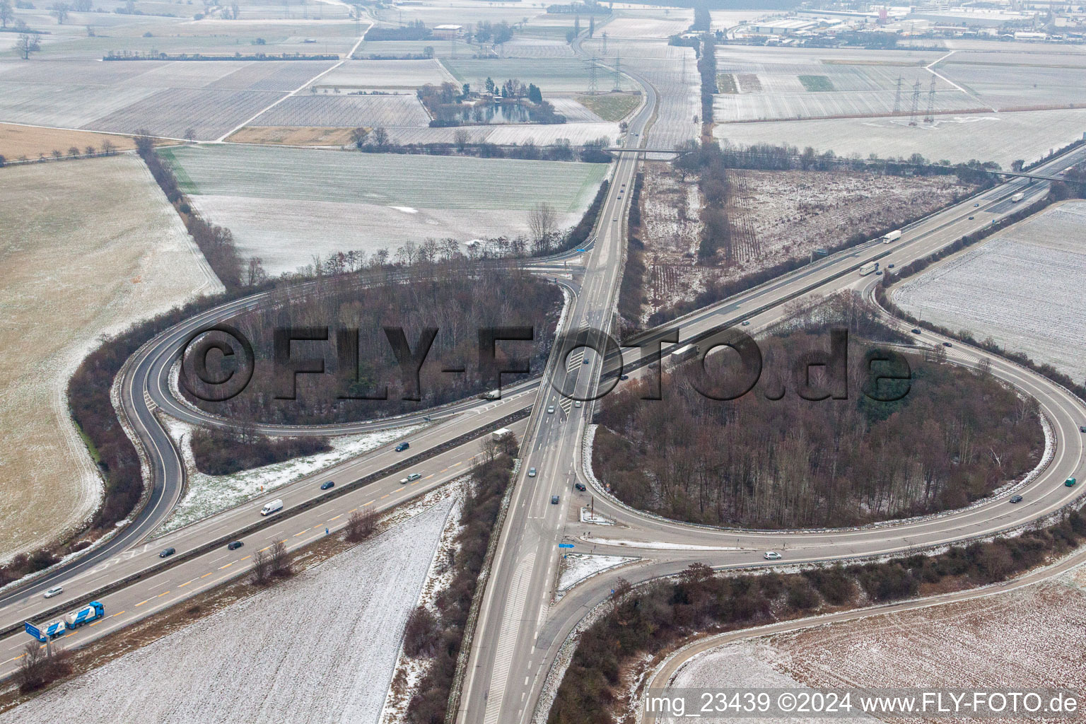 Wintry snowy Routing and traffic lanes during the highway exit and access the motorway A 61 in Hockenheim in the state Baden-Wurttemberg