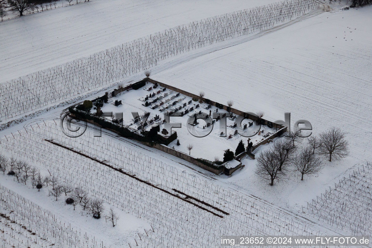 Oblique view of Cemetery in the snow in the district Kleinsteinfeld in Niederotterbach in the state Rhineland-Palatinate, Germany