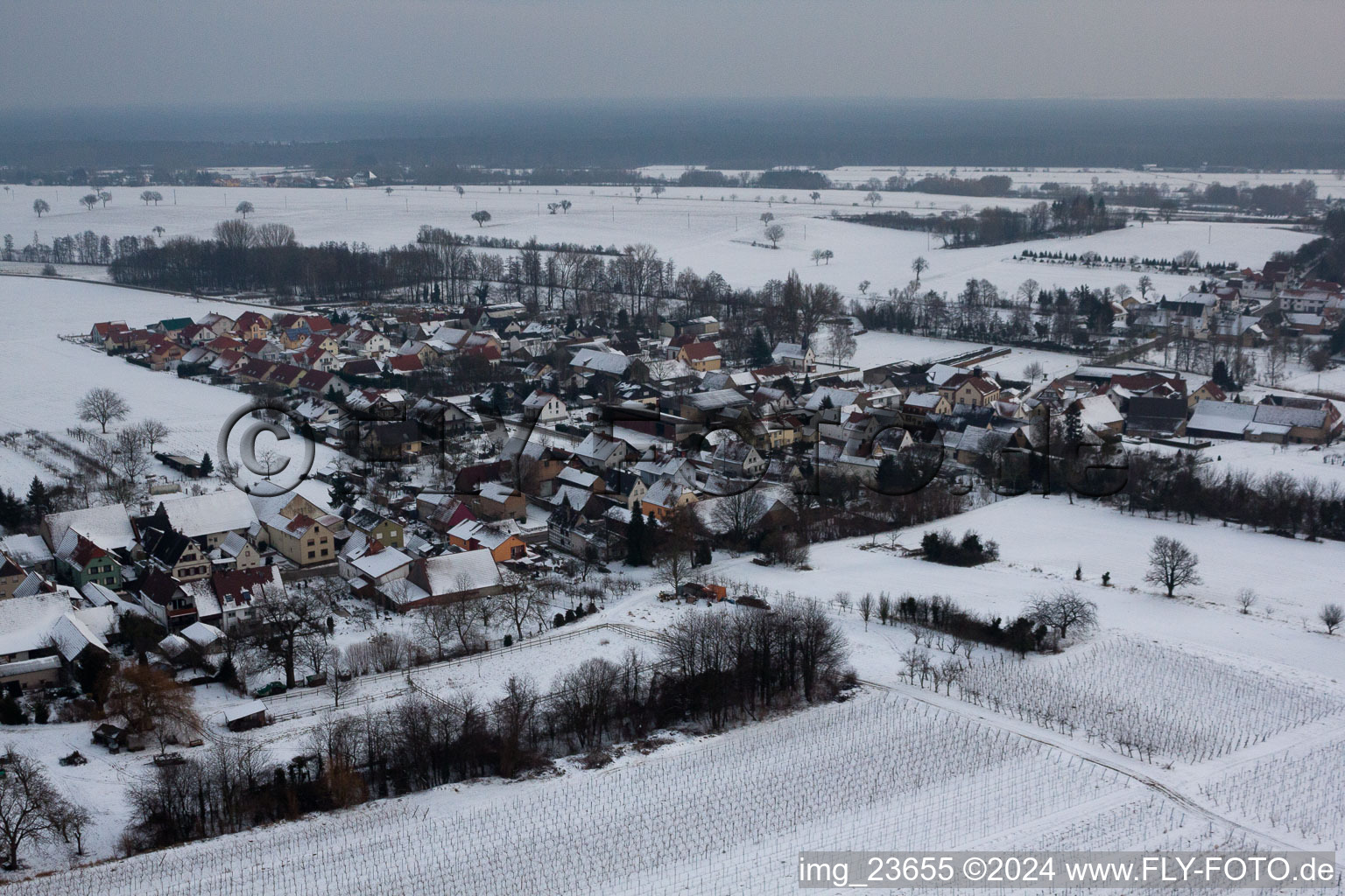 Drone recording of In winter in the snow in the district Kleinsteinfeld in Niederotterbach in the state Rhineland-Palatinate, Germany