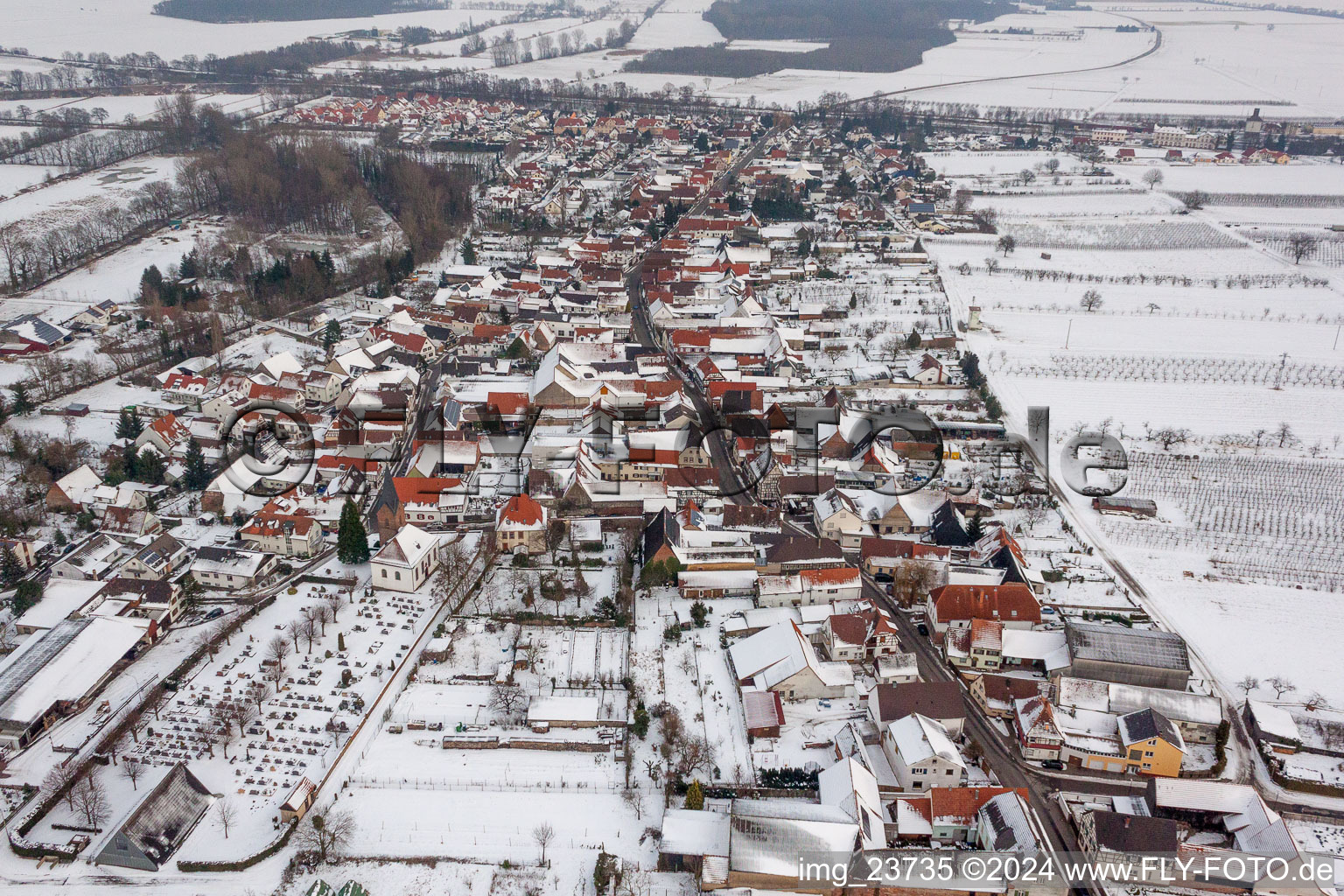 Wintry snowy Village - view on the edge of agricultural fields and farmland in Winden in the state Rhineland-Palatinate, Germany