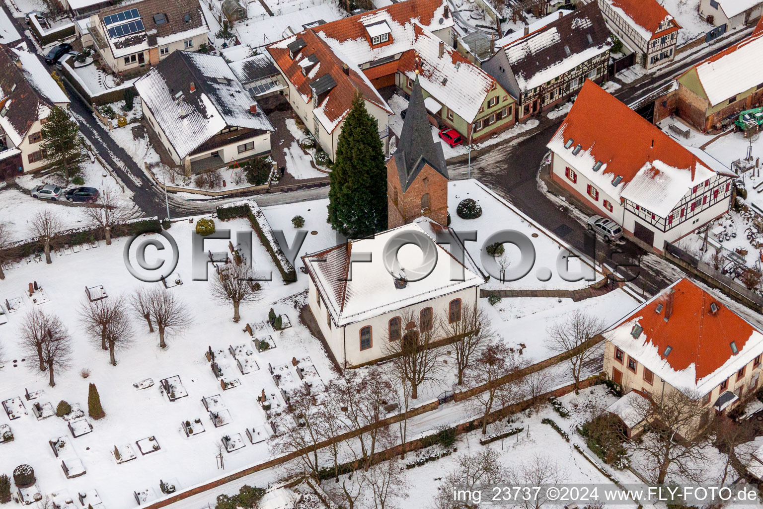 Wintry snowy Church building in the village of in Winden in the state Rhineland-Palatinate, Germany