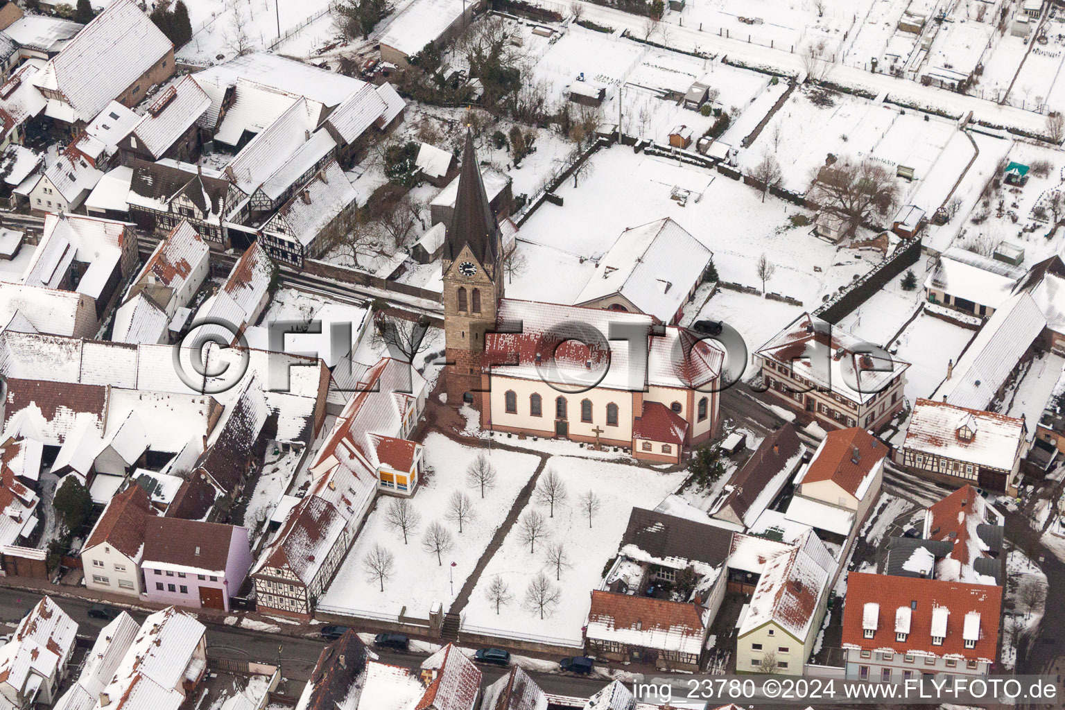 Wintry snowy Catholic Church building in the village of in Steinweiler in the state Rhineland-Palatinate, Germany