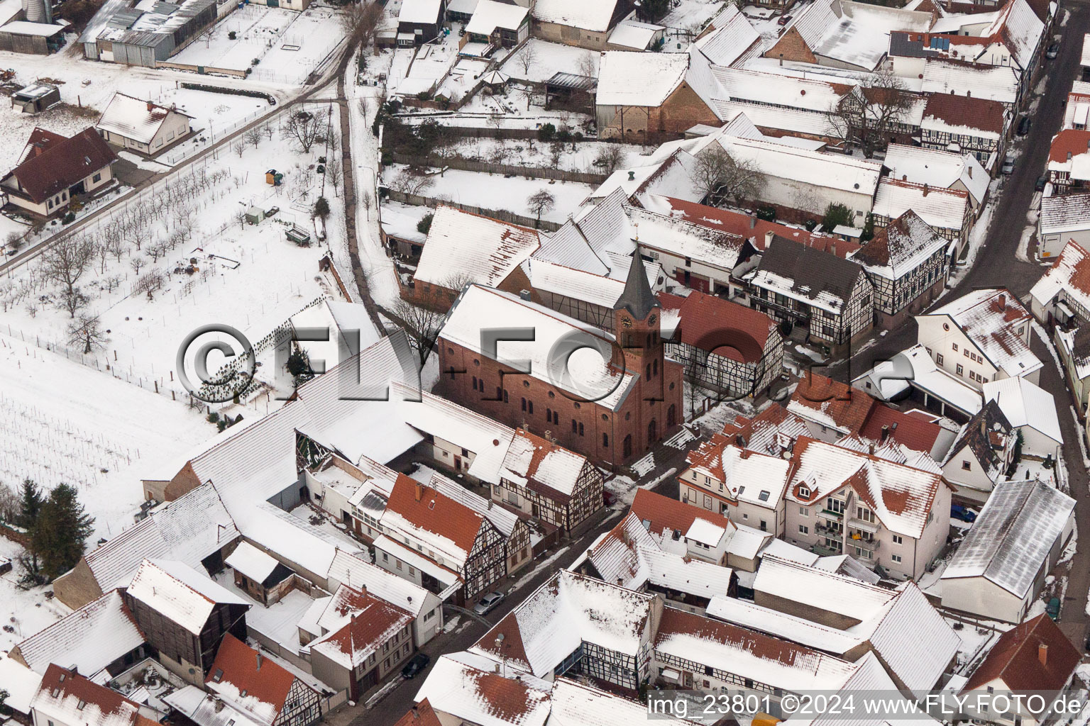 Wintry snowy Evangelic Church building in the village of in Steinweiler in the state Rhineland-Palatinate, Germany