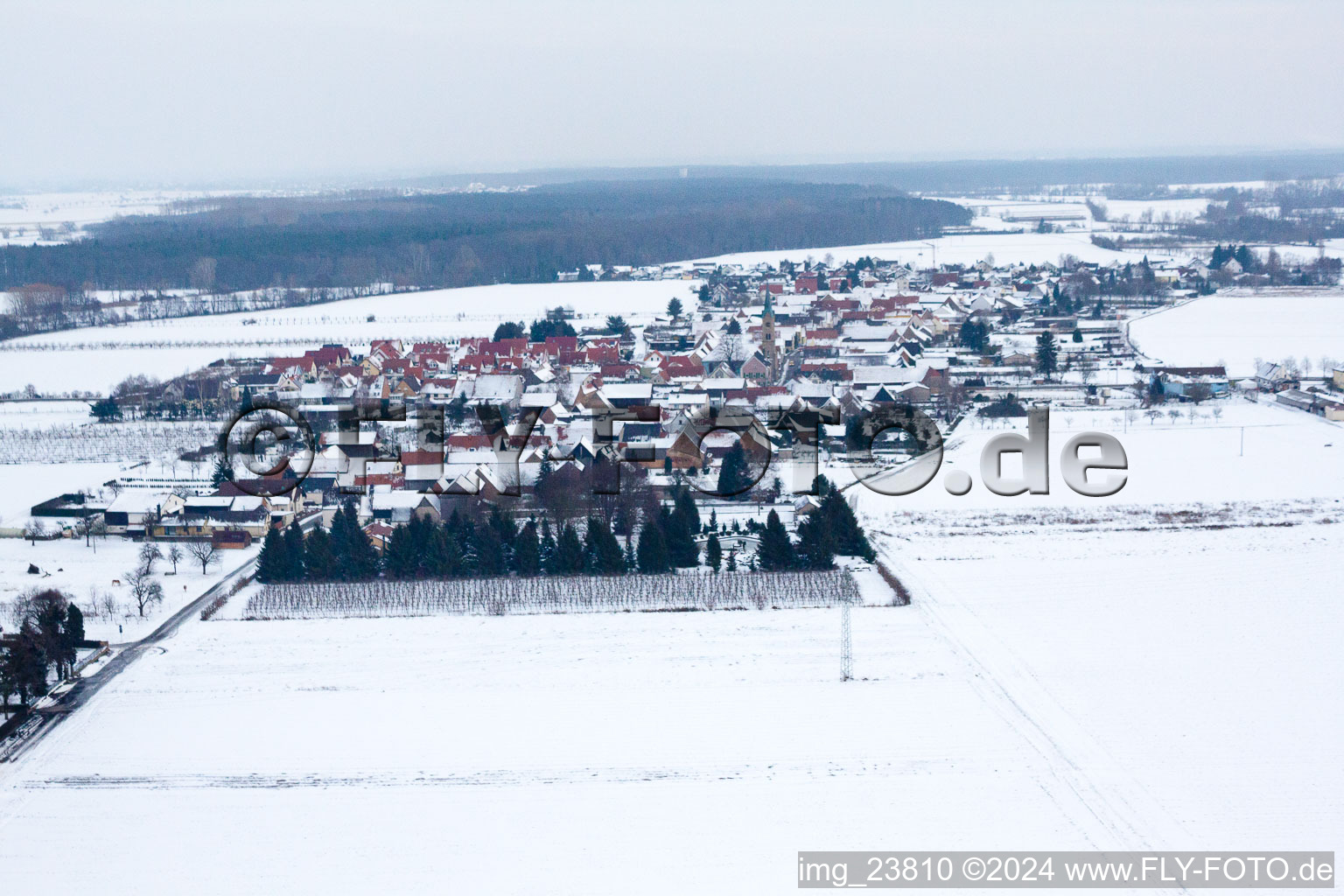 Aerial view of In winter when snow comes from the west in Erlenbach bei Kandel in the state Rhineland-Palatinate, Germany