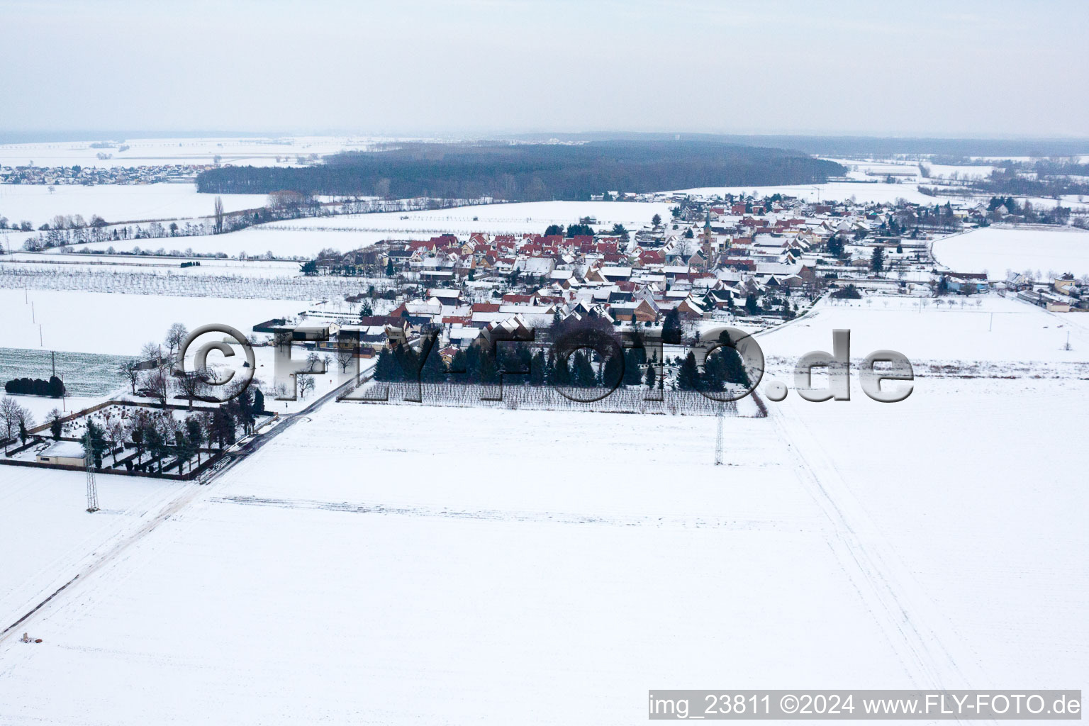 Aerial photograpy of In winter when snow comes from the west in Erlenbach bei Kandel in the state Rhineland-Palatinate, Germany