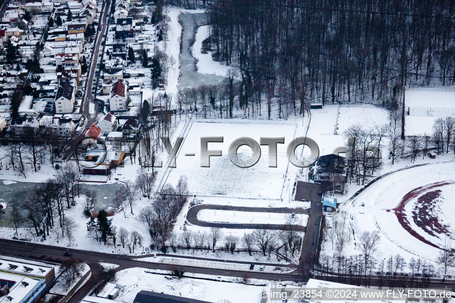 Bienwaldstadion: the new artificial turf pitch, covered in snow in Kandel in the state Rhineland-Palatinate, Germany