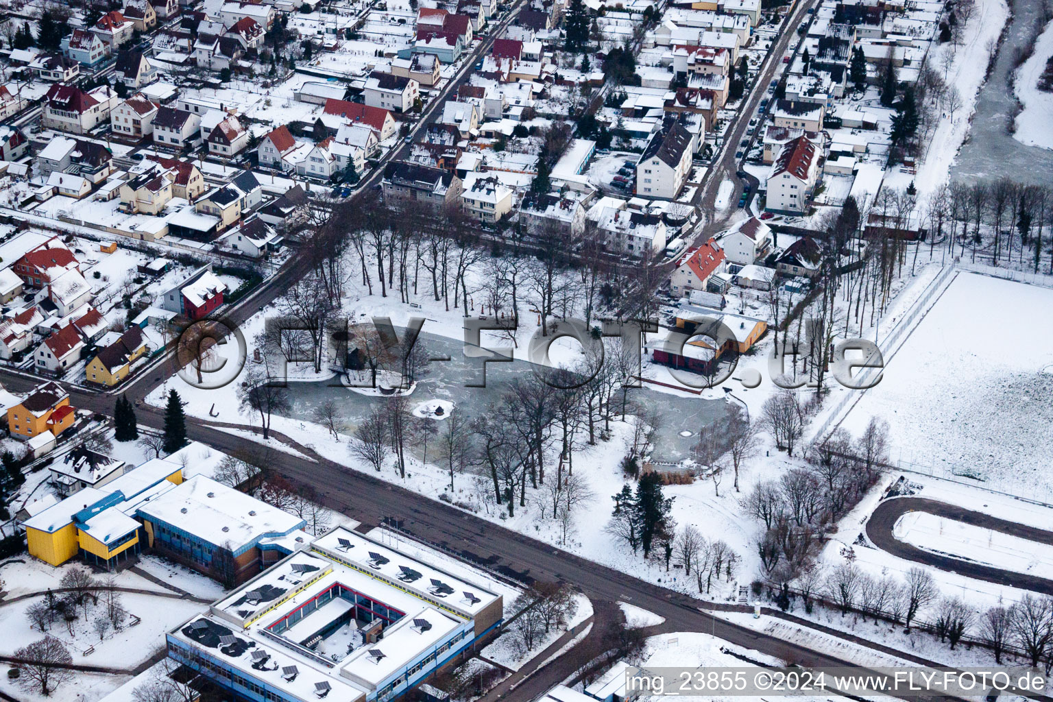 The Schwanenweier under renovation - frozen in Kandel in the state Rhineland-Palatinate, Germany