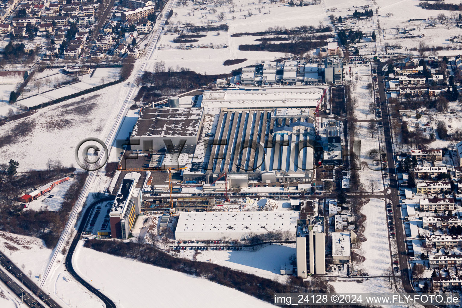 Wintry snowy Building and production halls on the premises of the chemical manufacturers L'OREAL Produktion Deutschland GmbH & Co. KG in the district Nordweststadt in Karlsruhe in the state Baden-Wurttemberg, Germany