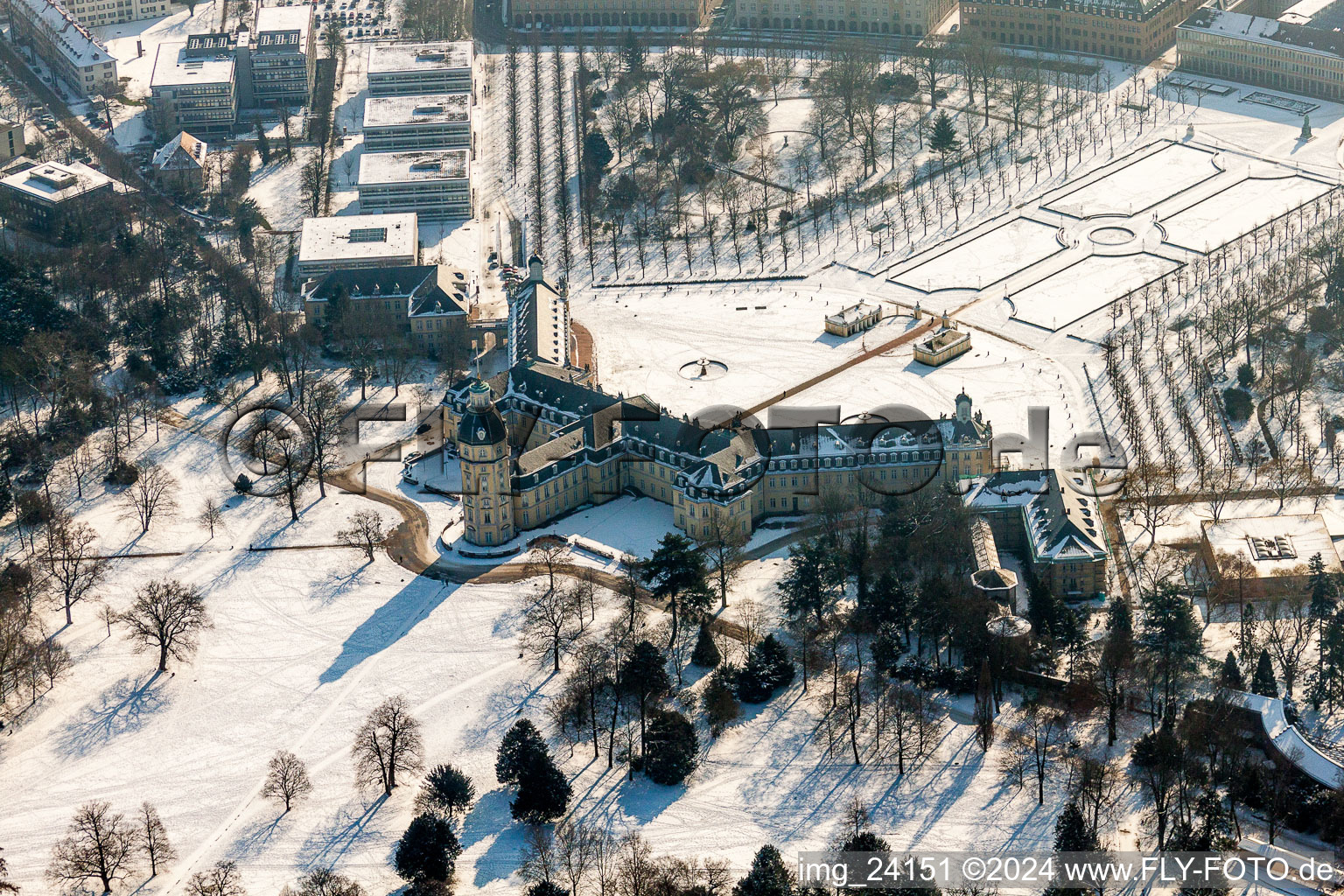 Wintry snowy Building complex in the park of the castle Schloss Karlsruhe in Karlsruhe in the state Baden-Wurttemberg, Germany