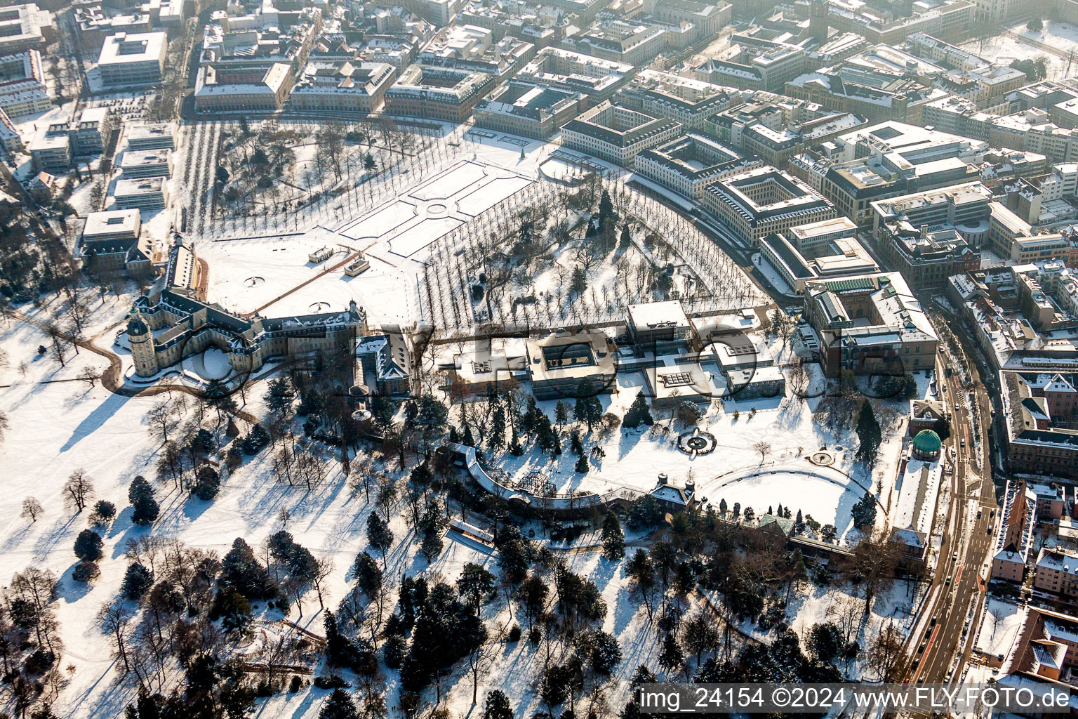 Aerial view of Wintry snowy Building complex in the park of the castle Schloss Karlsruhe in Karlsruhe in the state Baden-Wurttemberg, Germany