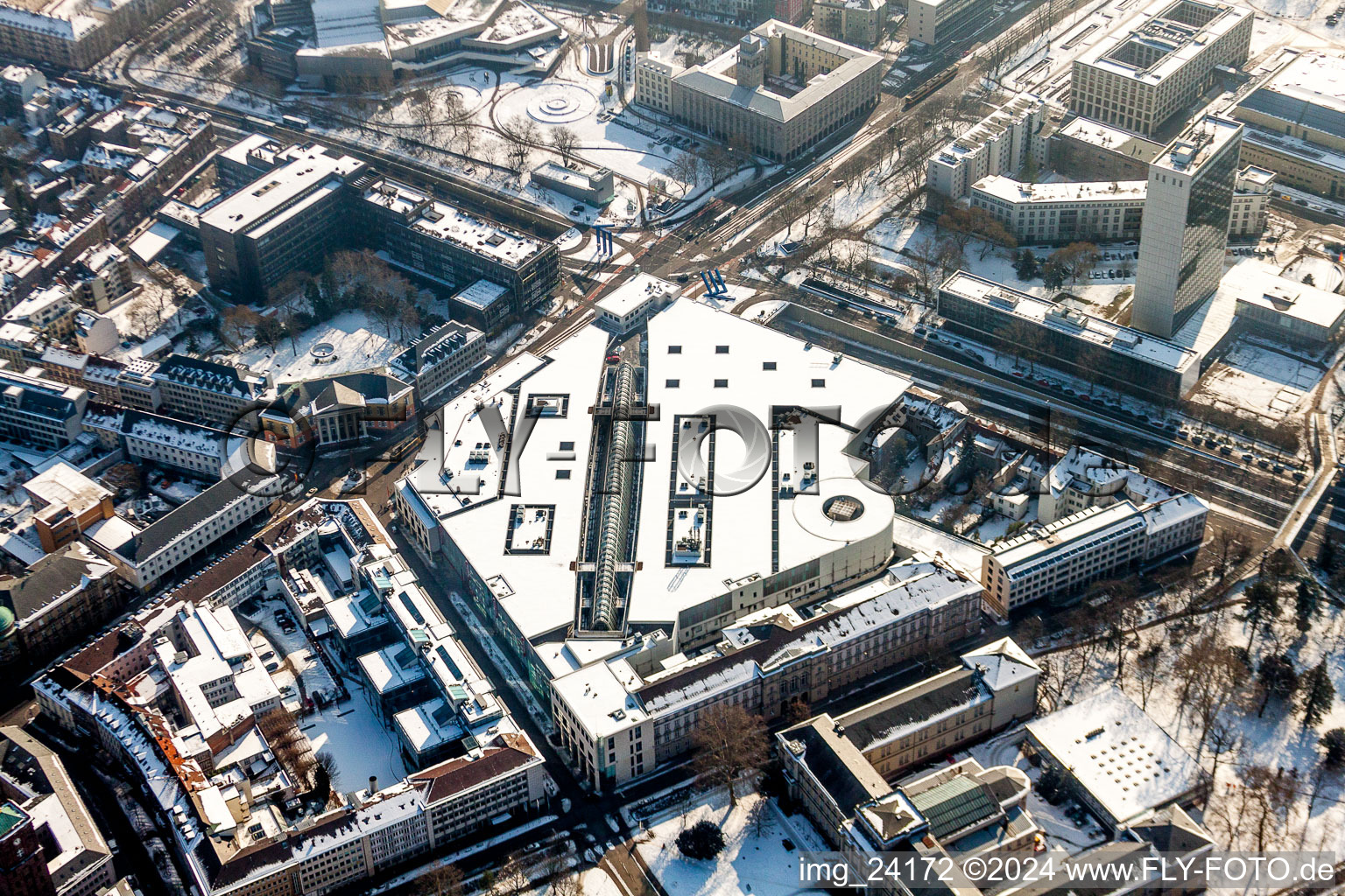 Wintry snowy Building of the shopping center Ettlinger Tor Zentrum in Karlsruhe in the state Baden-Wurttemberg, Germany