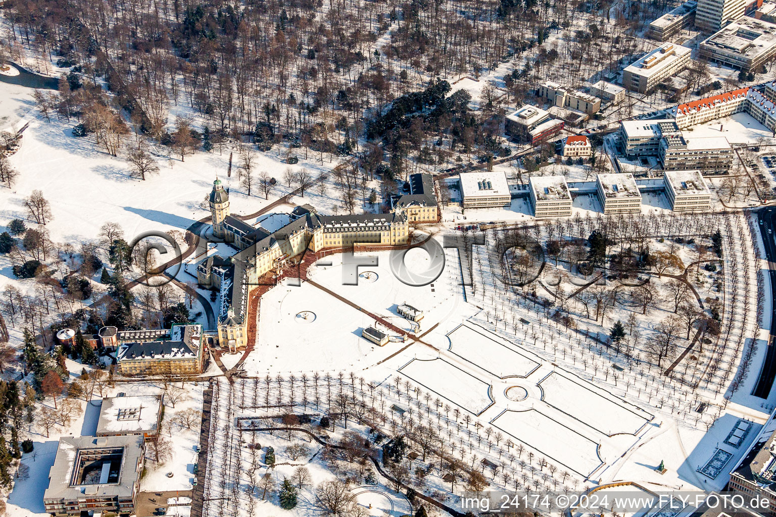 Oblique view of Wintry snowy Building complex in the park of the castle Schloss Karlsruhe in Karlsruhe in the state Baden-Wurttemberg, Germany