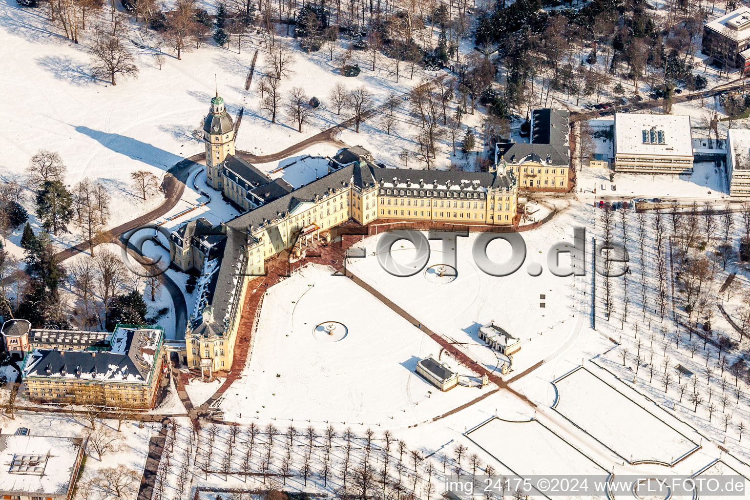 Wintry snowy Building complex in the park of the castle Schloss Karlsruhe in Karlsruhe in the state Baden-Wurttemberg, Germany from above