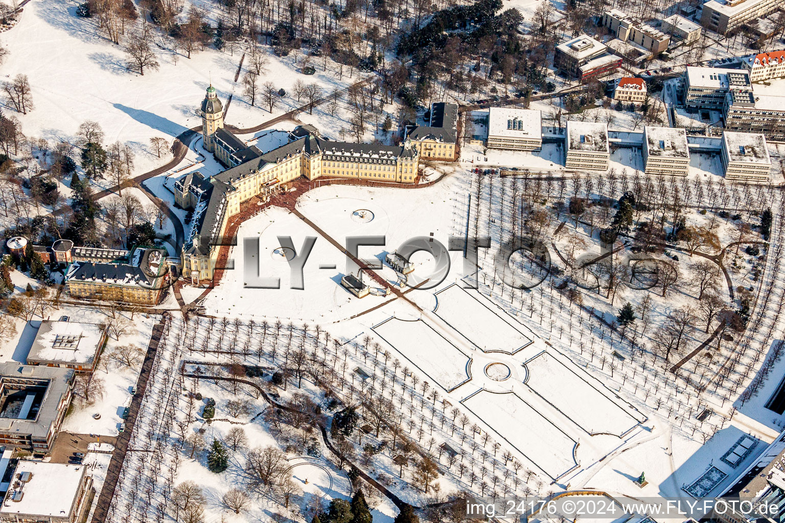 Wintry snowy Building complex in the park of the castle Schloss Karlsruhe in Karlsruhe in the state Baden-Wurttemberg, Germany out of the air