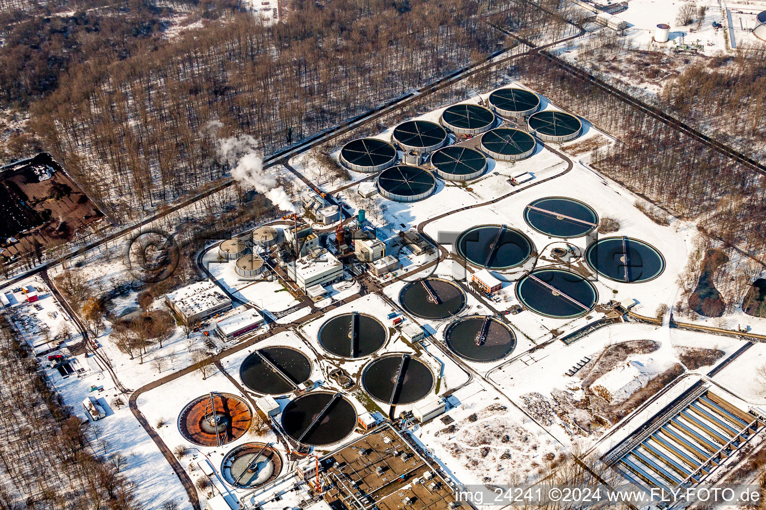 Wintry snowy Sewage works Basin and purification steps for waste water treatment of Klaerwerk Karlsruhe in the district Knielingen in Karlsruhe in the state Baden-Wurttemberg, Germany