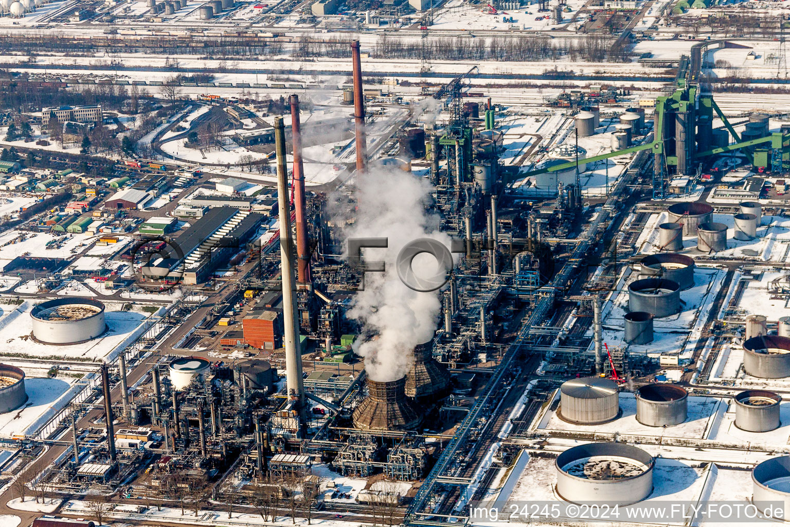 Aerial view of Wintry snowy Refinery equipment and management systems on the factory premises of the mineral oil manufacturers Mineraloelraffinerie Oberrhein in the district Knielingen in Karlsruhe in the state Baden-Wurttemberg, Germany
