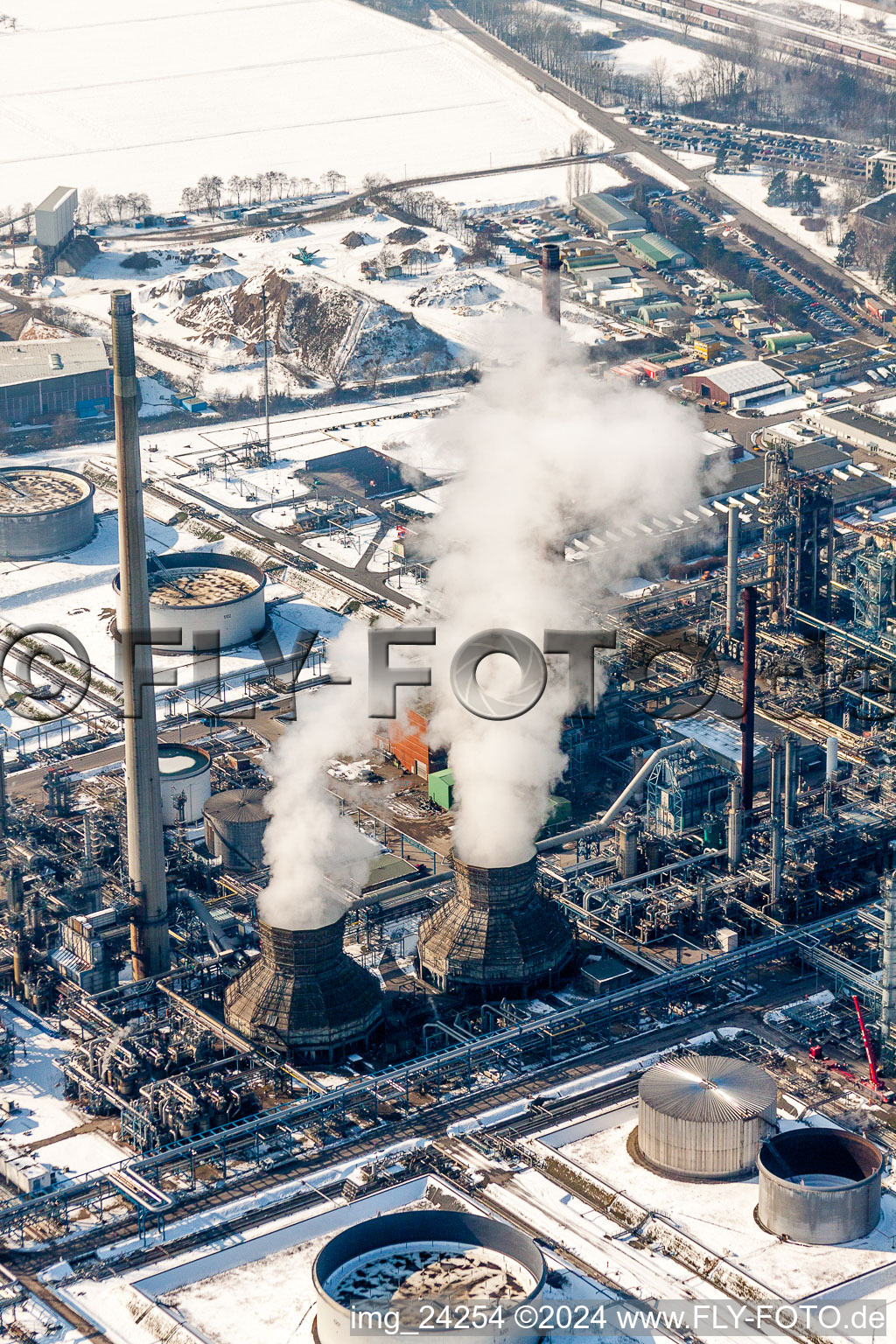Aerial photograpy of Wintry snowy Refinery equipment and management systems on the factory premises of the mineral oil manufacturers Mineraloelraffinerie Oberrhein in the district Knielingen in Karlsruhe in the state Baden-Wurttemberg, Germany
