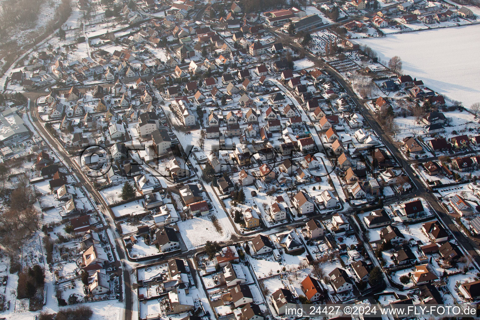 Wintry snowy Town View of the streets and houses of the residential areas in the district Ingenheim in Billigheim-Ingenheim in the state Rhineland-Palatinate