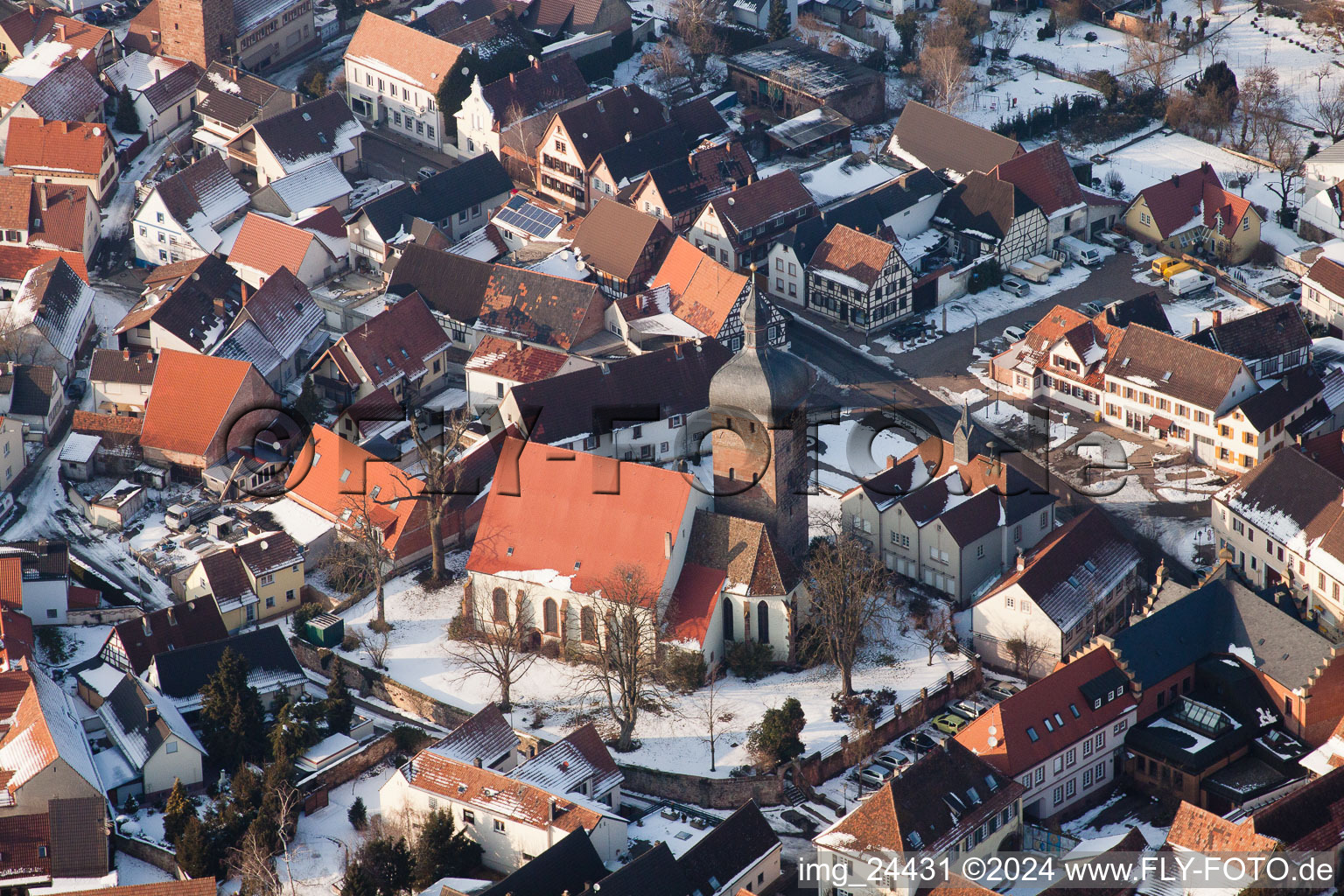 Aerial photograpy of Wintry snowy Town View of the streets and houses of the residential areas in the district Ingenheim in Billigheim-Ingenheim in the state Rhineland-Palatinate