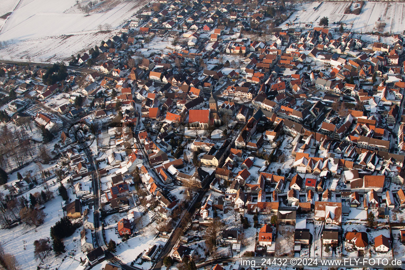 Oblique view of Wintry snowy Town View of the streets and houses of the residential areas in the district Ingenheim in Billigheim-Ingenheim in the state Rhineland-Palatinate
