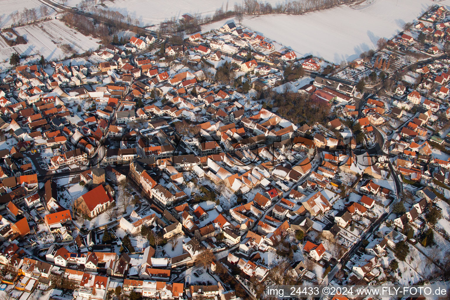 Wintry snowy Town View of the streets and houses of the residential areas in Billigheim-Ingenheim in the state Rhineland-Palatinate