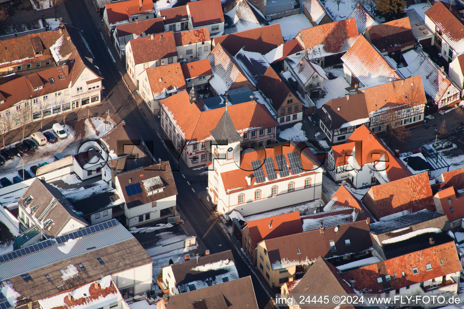 Wintry snowy Town View of the streets and houses of the residential areas in the district Ingenheim in Billigheim-Ingenheim in the state Rhineland-Palatinate from the plane