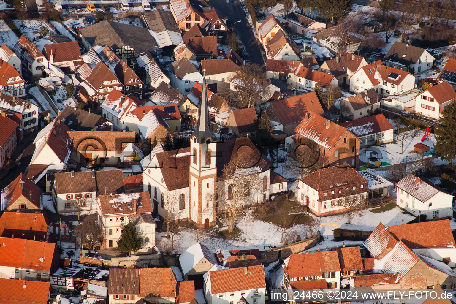 Winter snow covered village view in Göcklingen in the state Rhineland-Palatinate, Germany from above