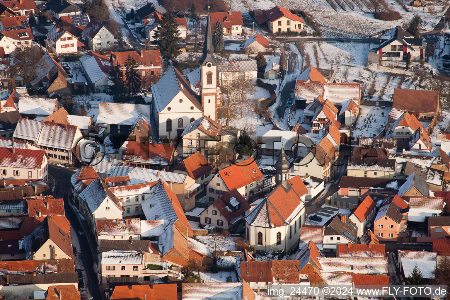 Winter snow covered village view in Göcklingen in the state Rhineland-Palatinate, Germany out of the air