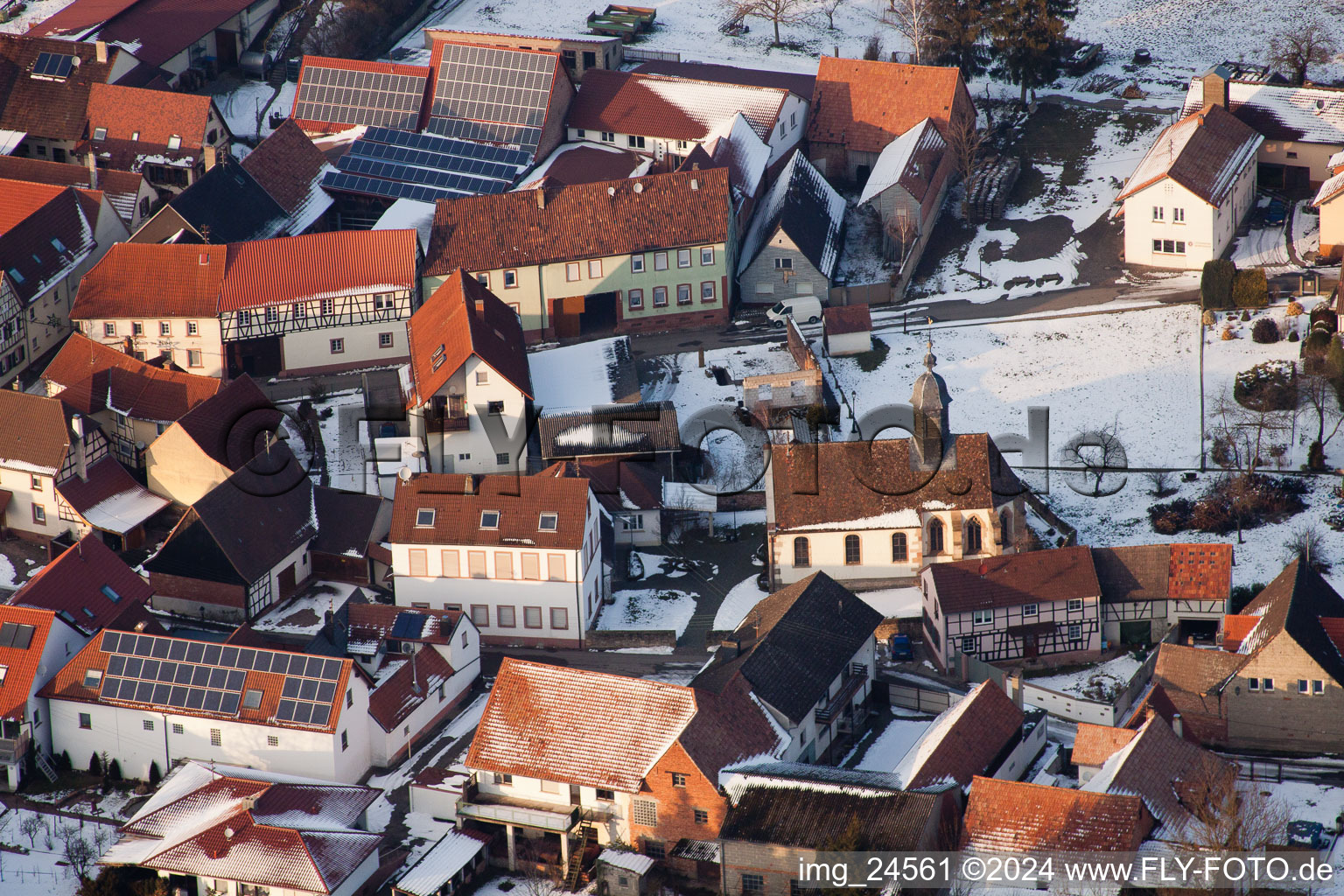 Aerial view of Wintry snowy Church building in the village of in Dierbach in the state Rhineland-Palatinate