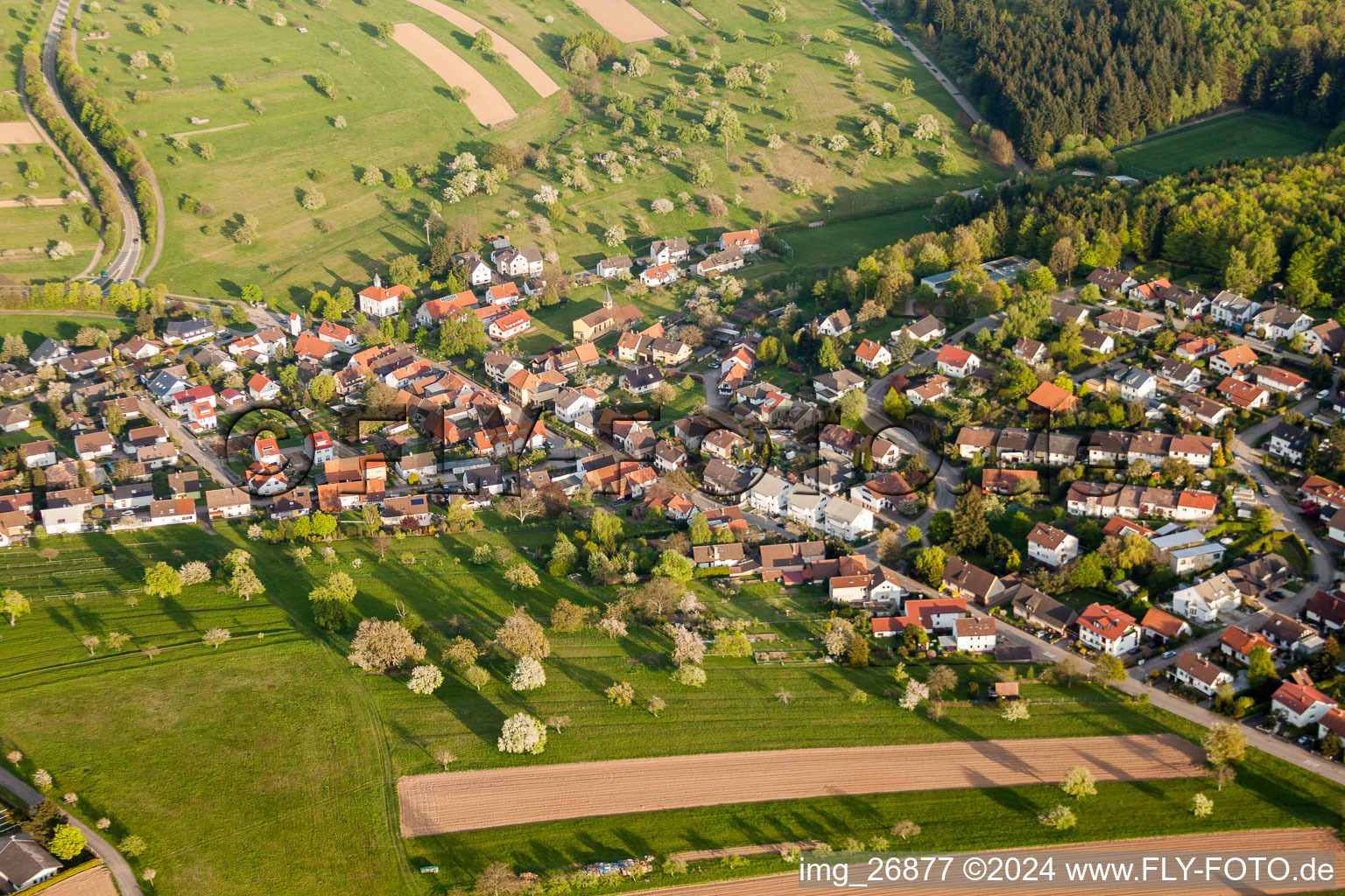 Aerial view of Village - view on the edge of agricultural fields and farmland in Schluttenbach in the state Baden-Wurttemberg, Germany