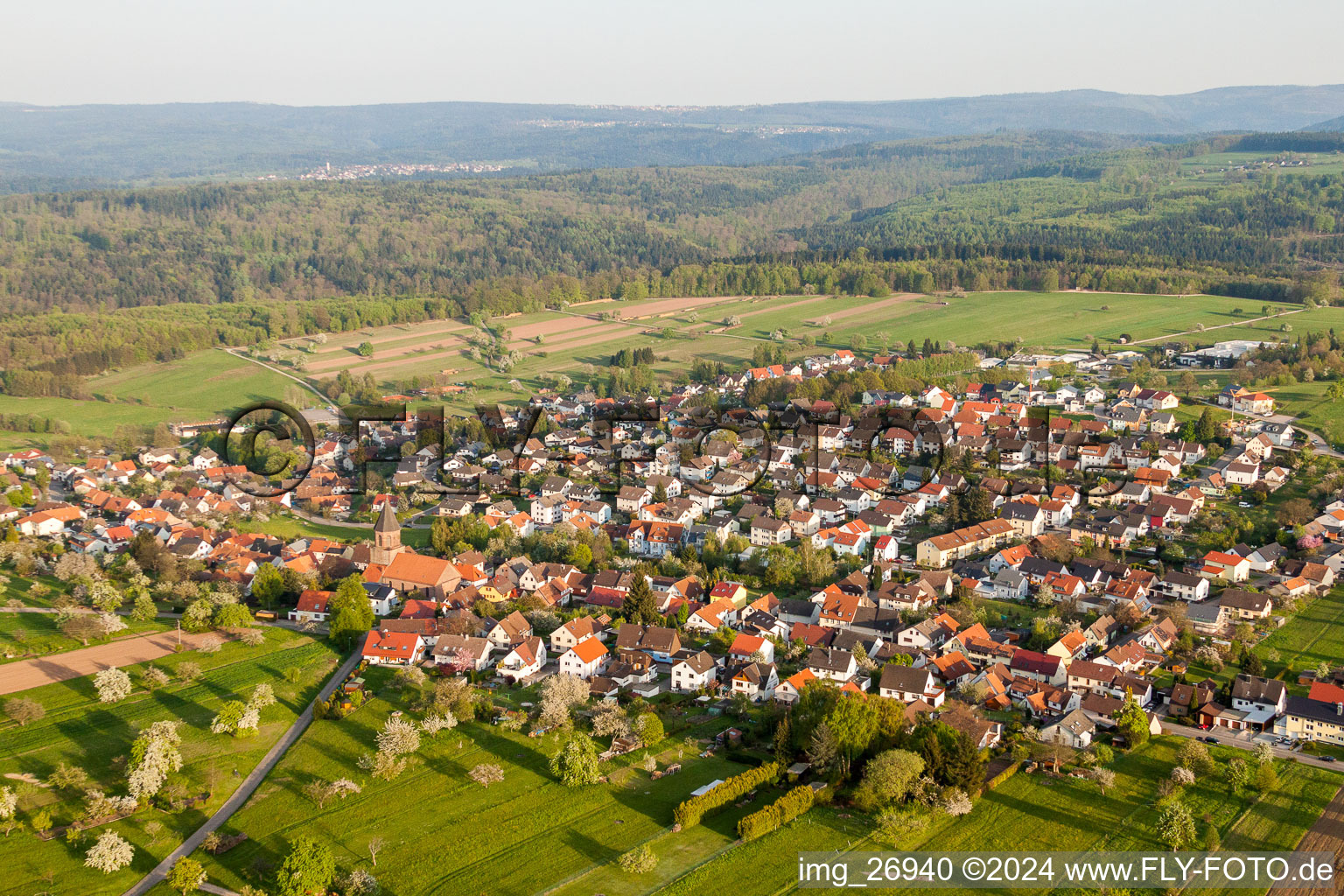 Oblique view of Village - view on the edge of agricultural fields and farmland in Voelkersbach in the state Baden-Wurttemberg, Germany