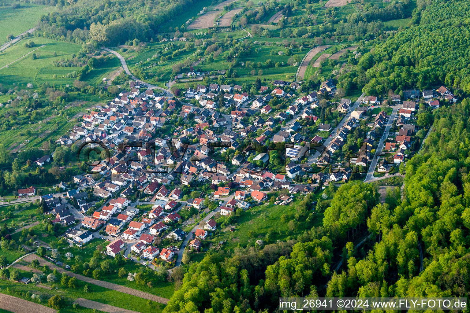 Aerial view of Village - view on the edge of agricultural fields and farmland in Sulzbach in the state Baden-Wurttemberg, Germany