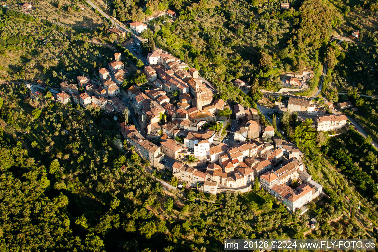 Village on a hill with church building of CHIESA S. BIAGIO in the village center in the district Scrofiano in Sinalunga in the state Siena, Italy