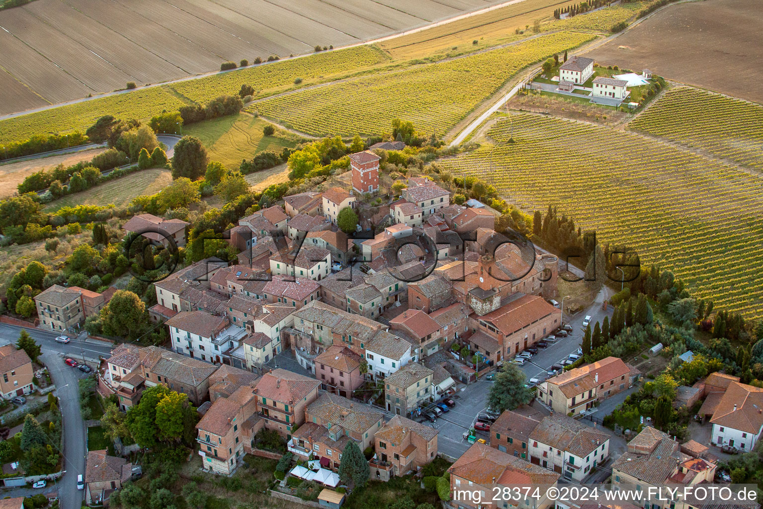 Village view of Valiano with Montepulciano vine yards in Toscana, Italy