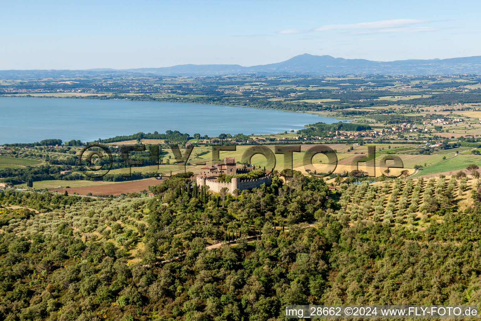 Castle of the fortress Castello di Montegualandro on lake Trasemino in Montecchio in Umbria, Italy