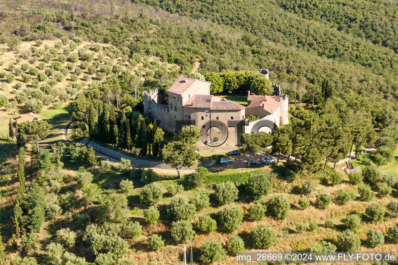 Aerial photograpy of Castle of the fortress Castello di Montegualandro on lake Trasemino in Montecchio in Umbria, Italy