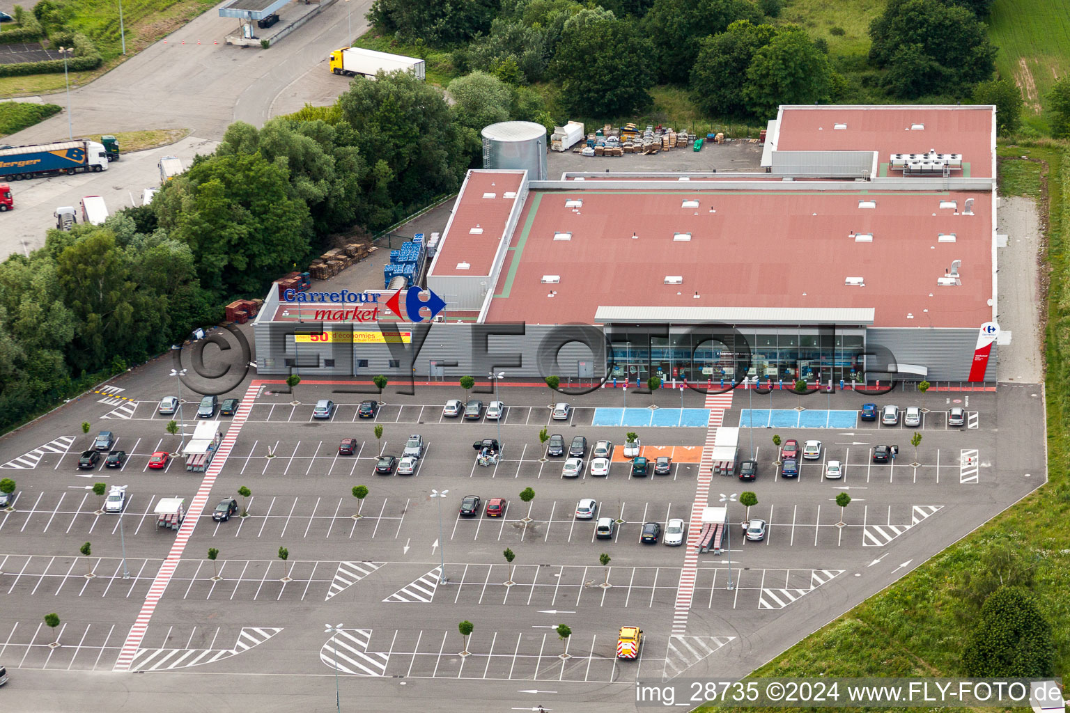 Aerial view of Store of the Supermarket Carrefour Market Lauterbourg in Scheibenhard in Grand Est, France