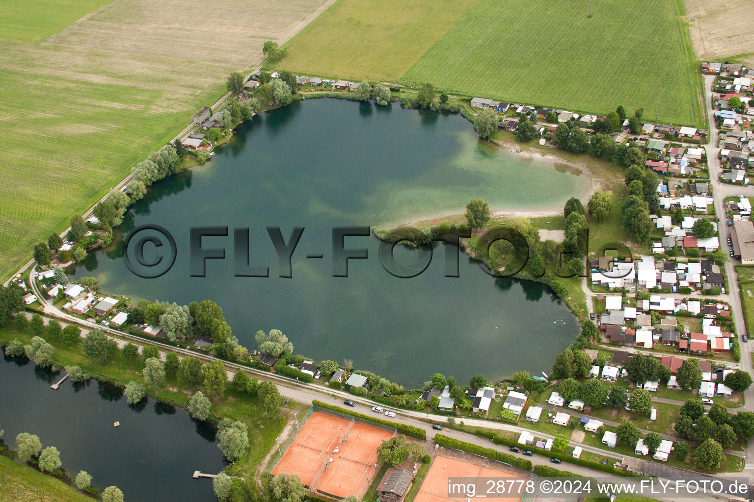 Aerial view of Camping with caravans and tents at the lake in the district Beinheim in Seltz in Grand Est, France