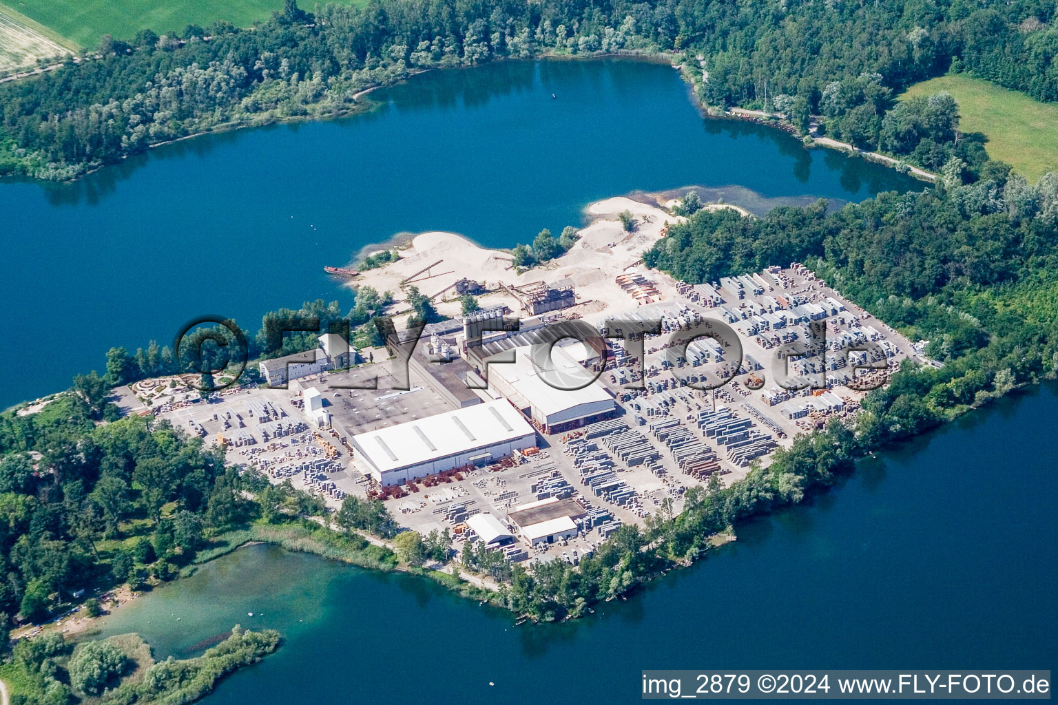 Building and production halls on the premises of the concrete stone manufacturer Lithon Plus GmbH & Co. KG. in the district Eggenstein in Eggenstein-Leopoldshafen in the state Baden-Wurttemberg