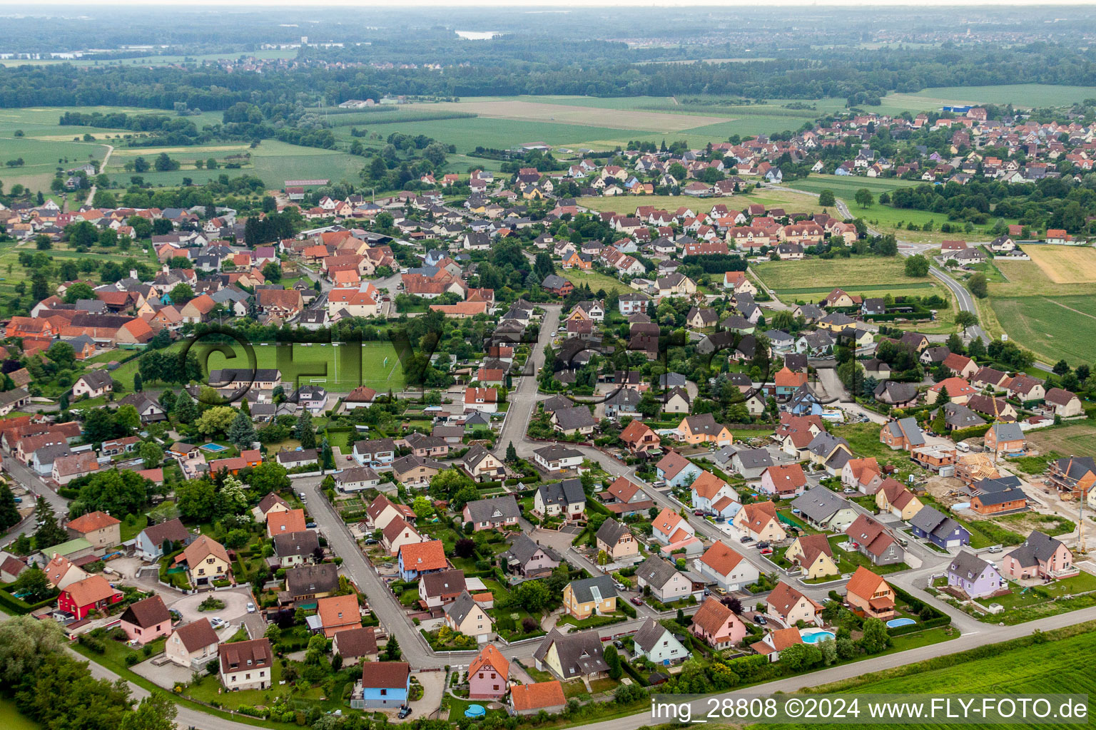 Village - view on the edge of agricultural fields and farmland in Stattmatten in Grand Est, France