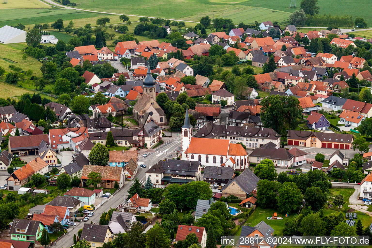 Aerial view of Two Church buildings in the village of in Stattmatten in Grand Est, France