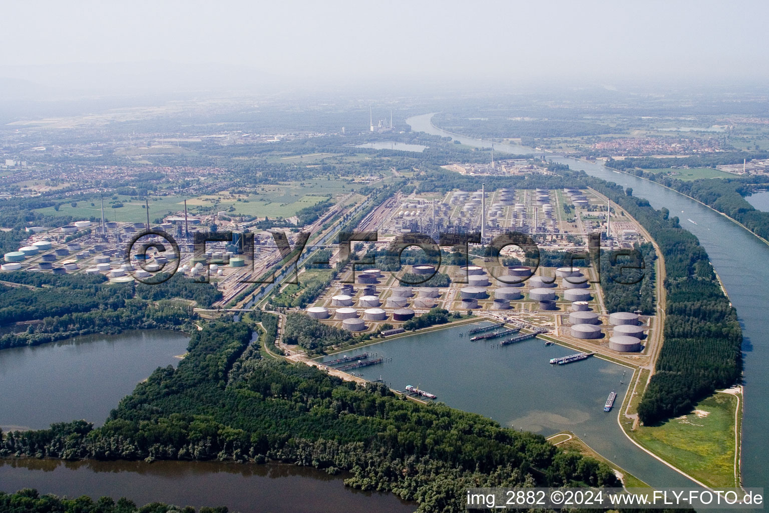 Refinery on the Rhine from the north in the district Knielingen in Karlsruhe in the state Baden-Wuerttemberg, Germany