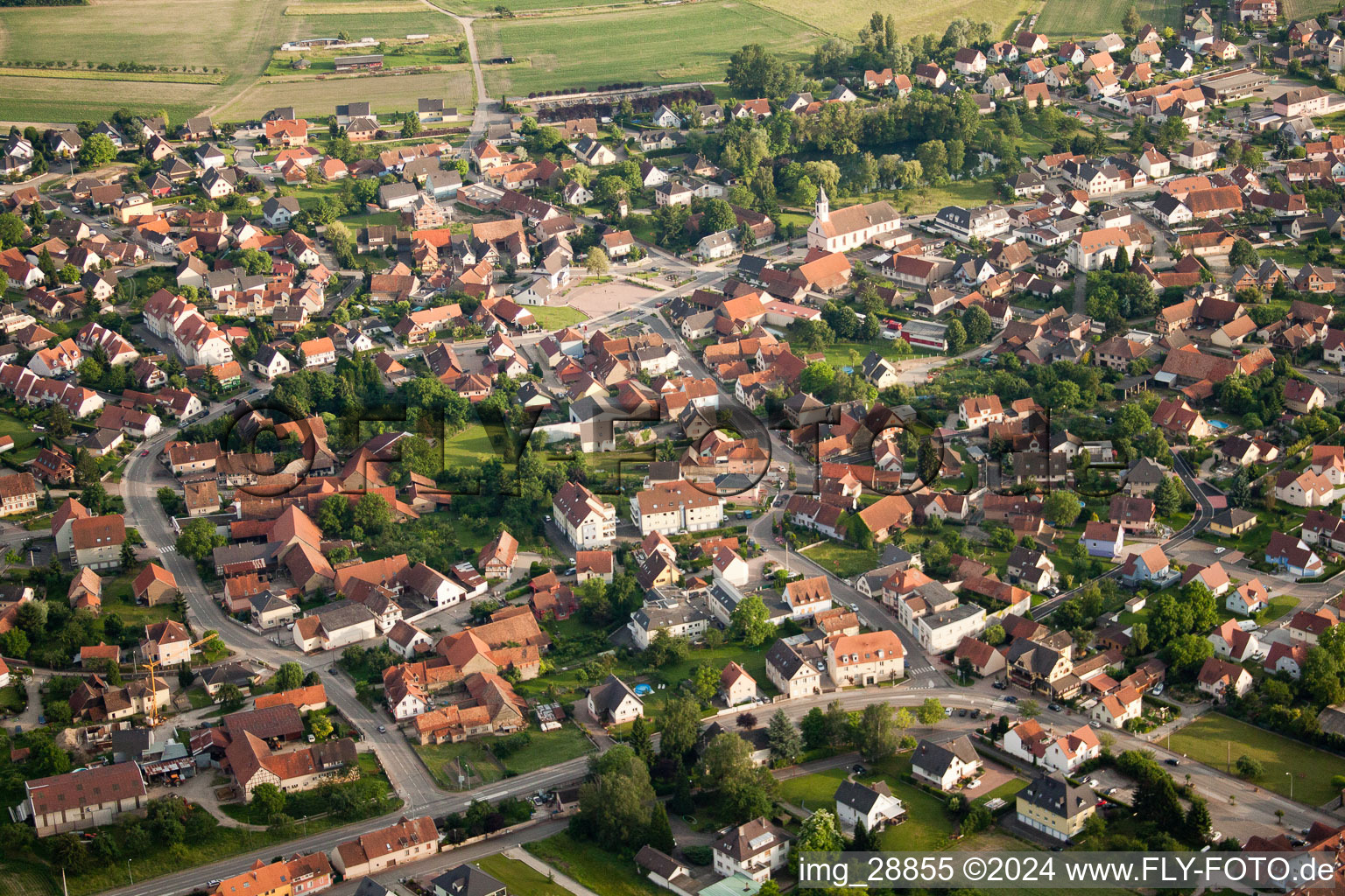 Village - view on the edge of agricultural fields and farmland in Kilstett in Grand Est, France