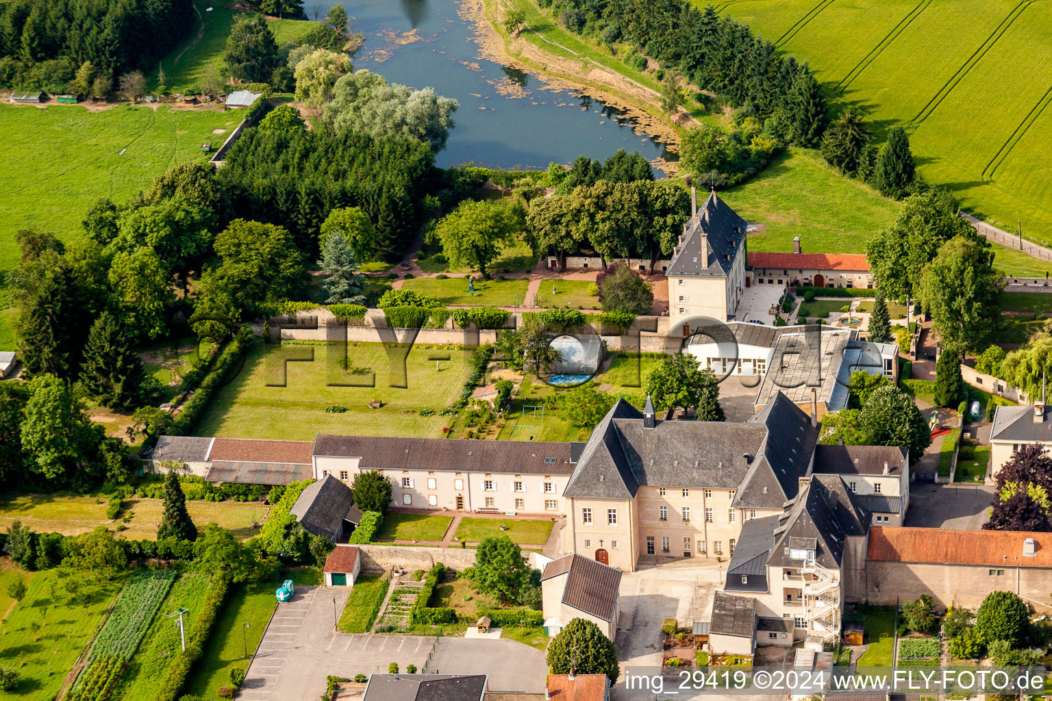 Building complex in the park of the castle at shore of the Mosel river in Rettel in Grand Est, France