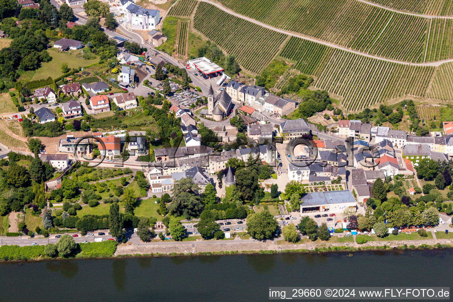 Town with the European Museum Schengen between the banks of the river of the river Mosel and steep Wineyards in Schengen in Grevenmacher, Luxembourg